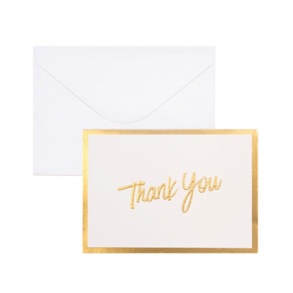 Gift card with thank you in gold writing and a gold border. White envelope behind.