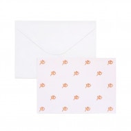 Gift card with rose gold XO, kisses and hugs. White envelope behind.