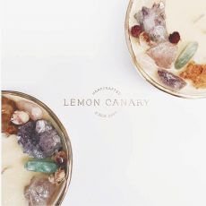 Lemon Canary crystal soy candle bowls with gold foil Lemon Canary logo in between.