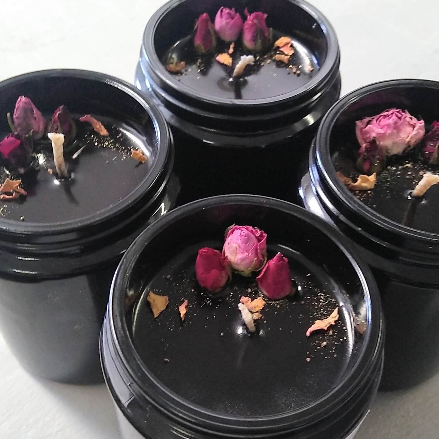 Group Of 4 Love And Gratitude Soy Candles In Black Miron Glass With Rose Buds And Petals