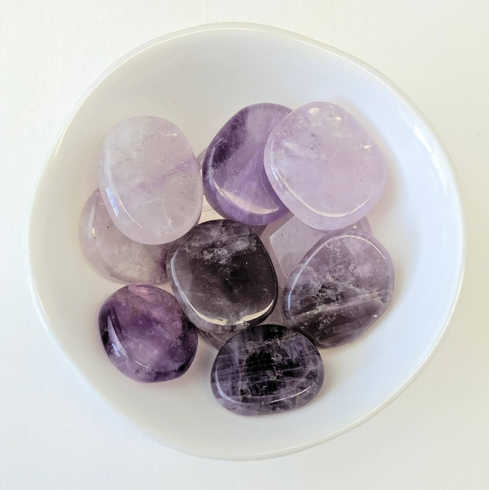Amethyst Crystal Flat Stone Discs In A White Bowl - Top View