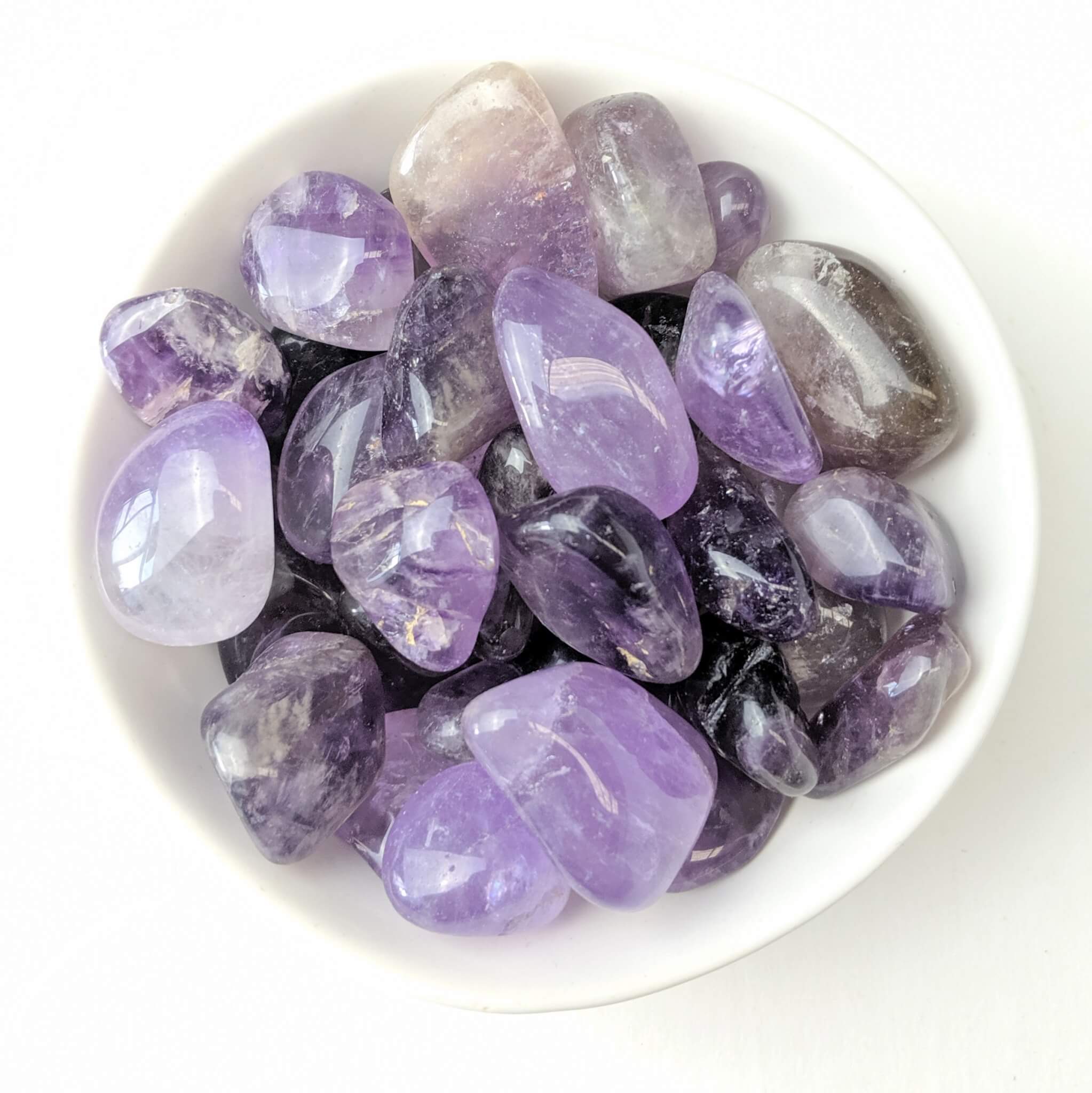 Amethyst Crystal Tumble Stones in a White Bowl Top View