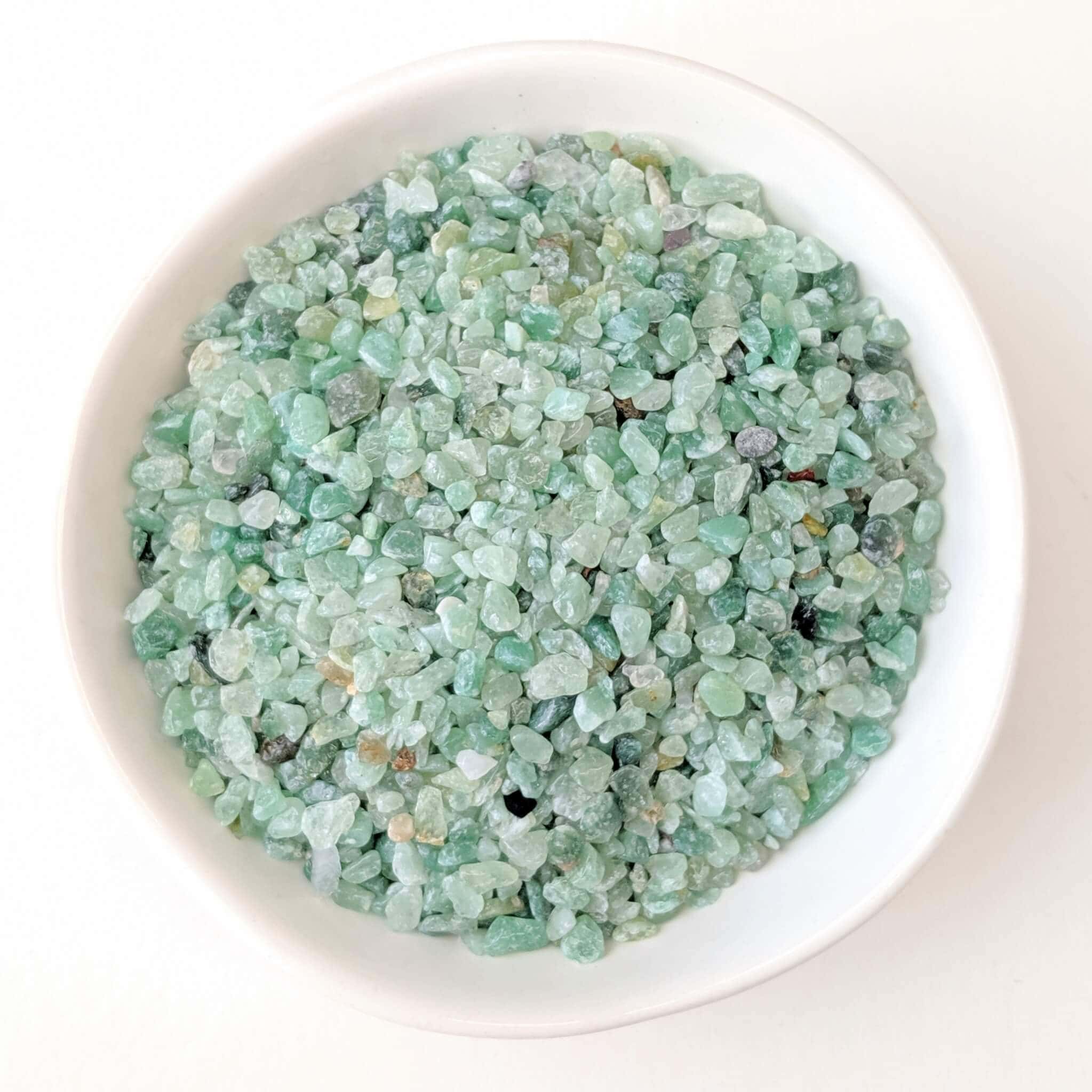 Aventurine Crystal Chips in a White Bowl Top View