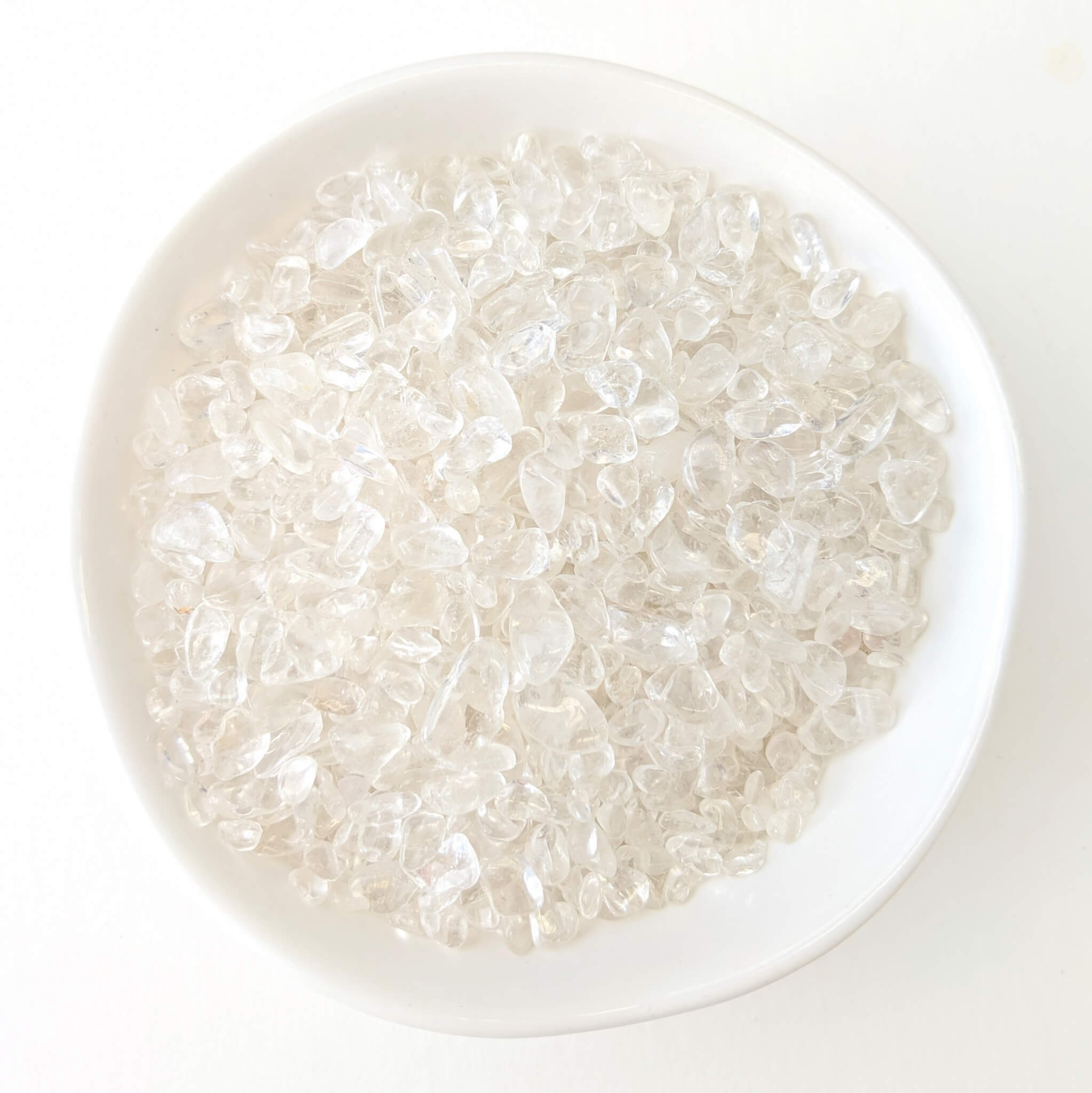 Clear Quartz Crystal Chips in a White Bowl Top View