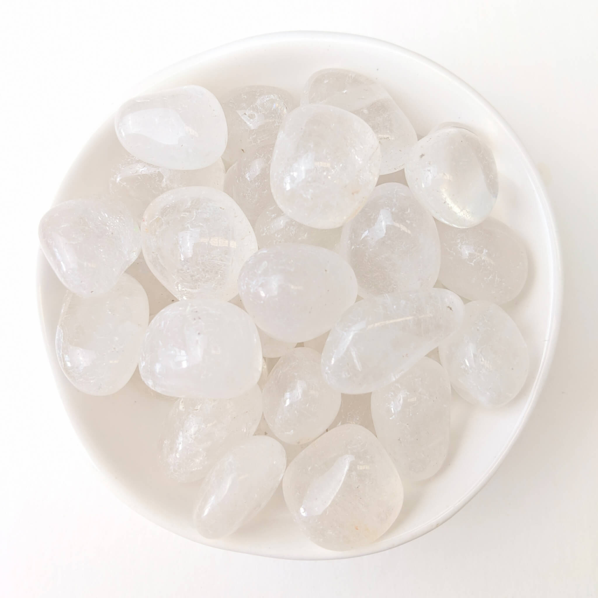 Clear Quartz Crystal Tumble Stones in a White Bowl Top View