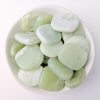 Jade Crystal Flat Stone Discs in a White Bowl Top View