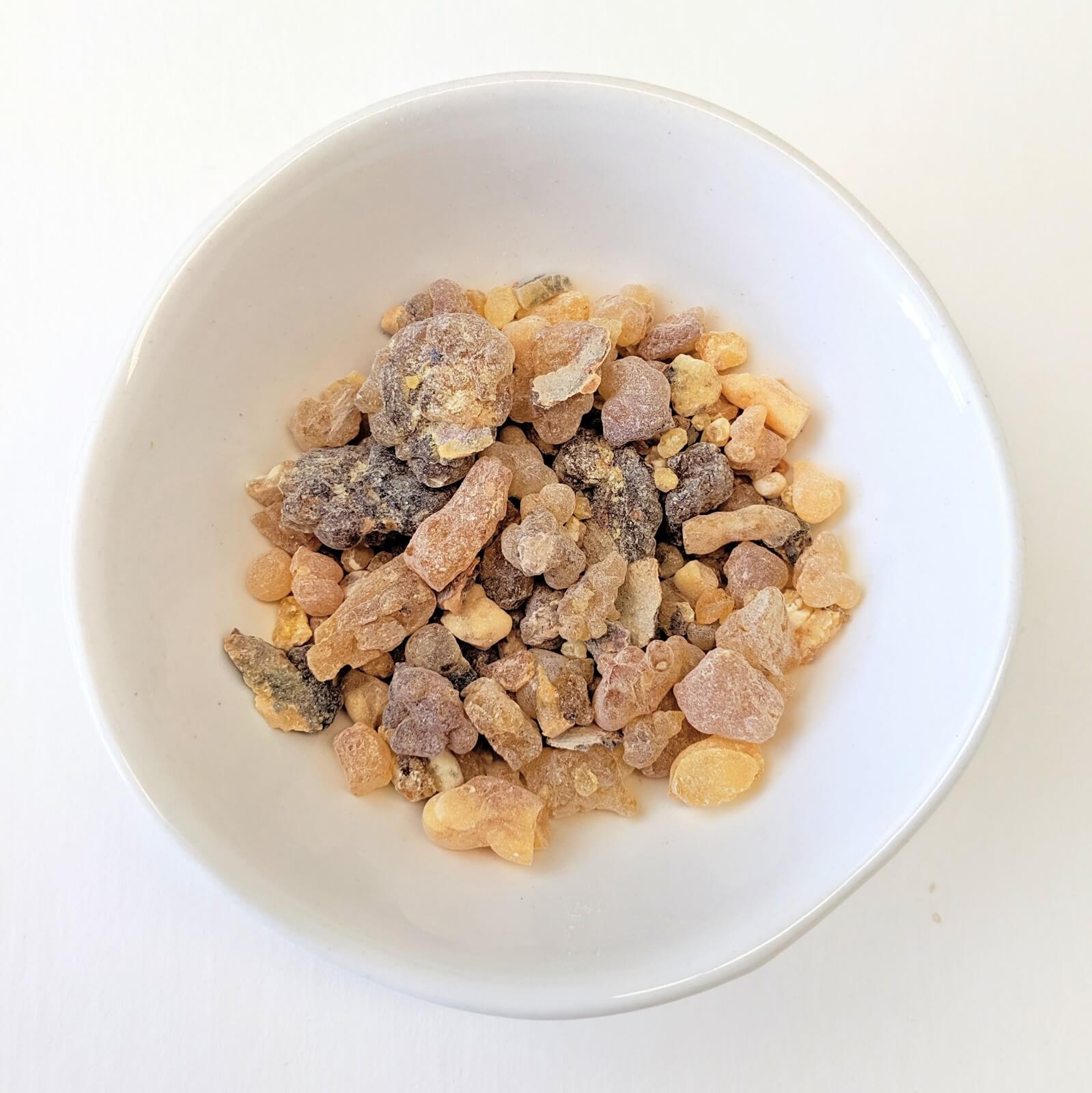 Organic Myrrh Pieces In A White Bowl - Top View