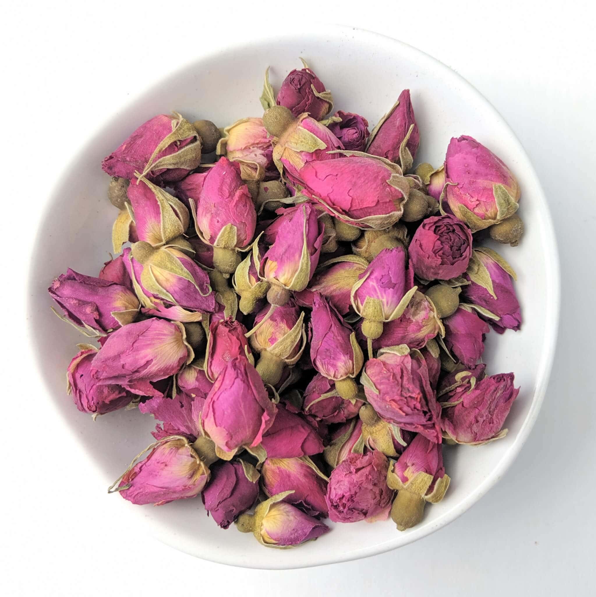 Organic Red Rose Buds in a White Bowl Top View