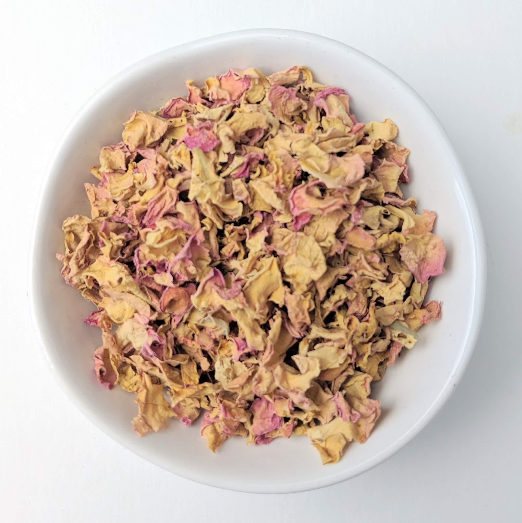 Organic Rose Petals in a White Bowl Top View