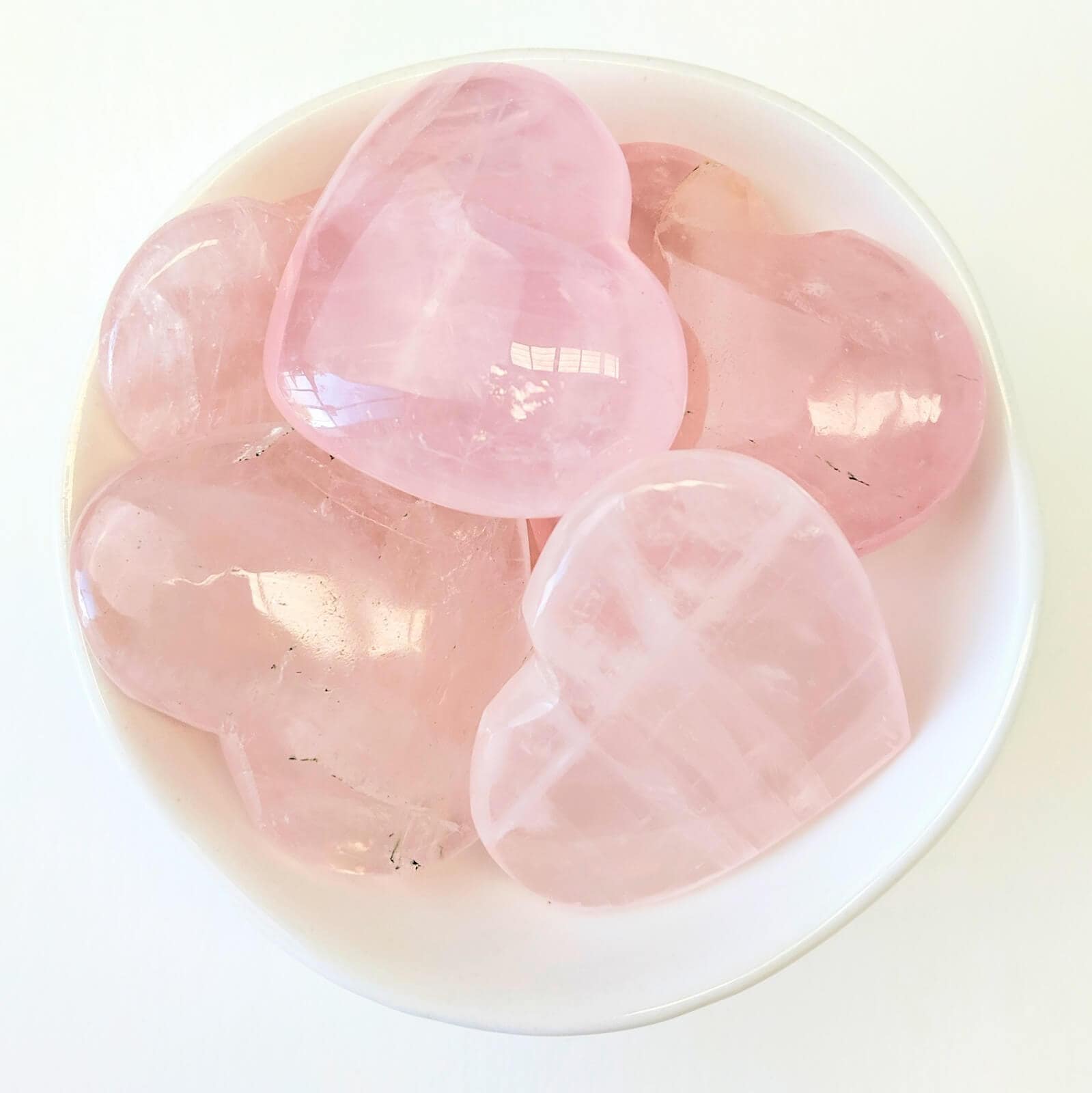 Rose Quartz Crystal Hearts In A White Bowl - Top View
