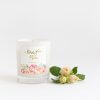 I Love You Mum Soy Candle In White Glass With Peony And Marshmallow Scent By Lemon Canary. Beside a small bunch of light coloured roses.