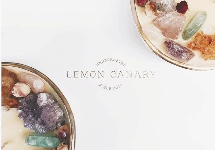 Lemon Canary crystal soy candle bowls with gold foil Lemon Canary logo in between.